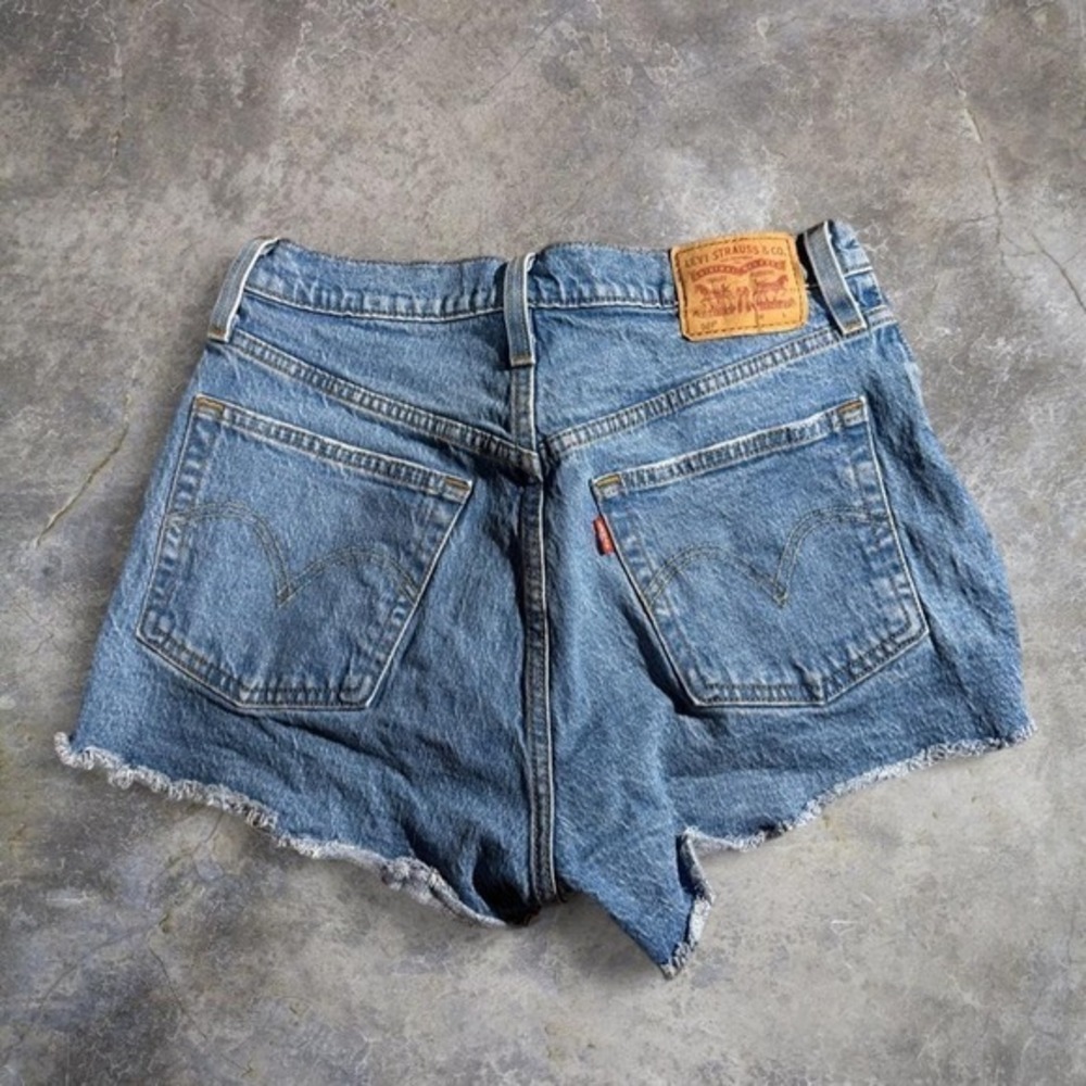 Vintage Levi's 501 XX light wash denim cutoff‎ shorts button fly raw hem